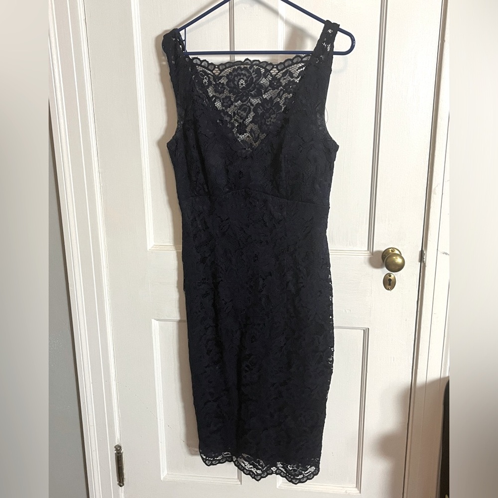 Navy blue knee length dress. Open V neck back.